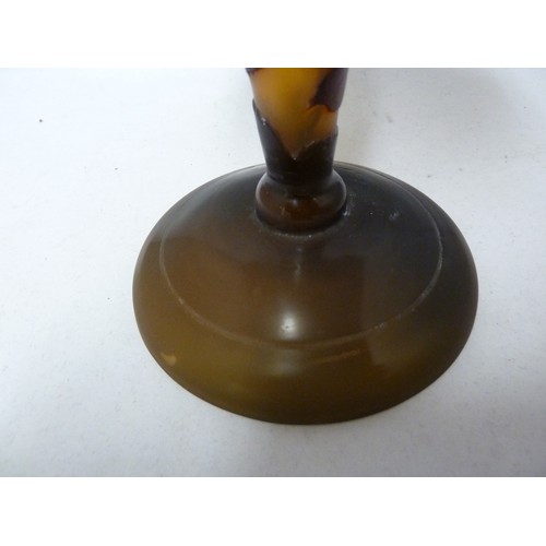 120 - A cameo glass table lamp and cover, the domed glass shade on glass baluster stem cased in green amet... 