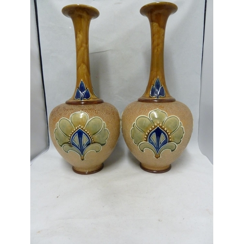 100 - A large pair of Doulton Slaters patent bottle vases, decorated by Bessie Newbery, decorated in typic... 