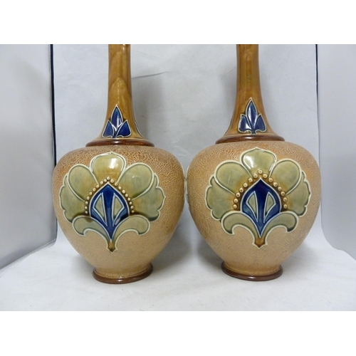 100 - A large pair of Doulton Slaters patent bottle vases, decorated by Bessie Newbery, decorated in typic... 