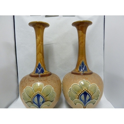 100 - A large pair of Doulton Slaters patent bottle vases, decorated by Bessie Newbery, decorated in typic... 