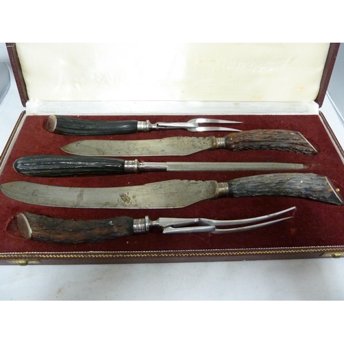 133 - Asprey - a five piece carving set, in fitted case, antler handles.