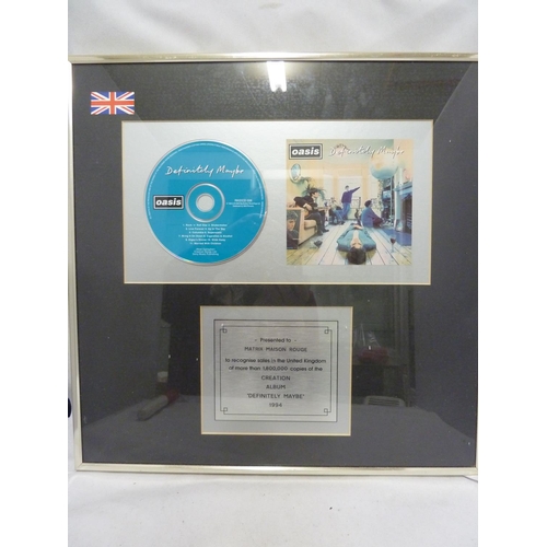 136 - Oasis, Definitely Maybe - an In-house award mounted CD Disk, presented to Matrix Maison Rouge to rec... 