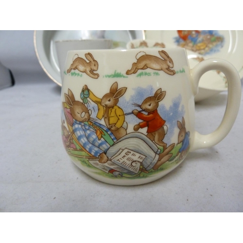 146 - Bunnykins, Royal Doulton - Nursery ware, comprising, mug, bowl and plate; a Grimwades Peter Rabbit c... 