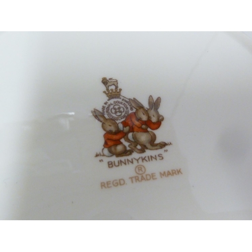 146 - Bunnykins, Royal Doulton - Nursery ware, comprising, mug, bowl and plate; a Grimwades Peter Rabbit c... 