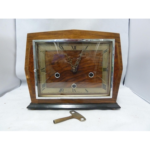 148 - Enfield Clock Co (London) Limited - An Art Deco Chiming mantel clock, with marquetry case, dial mark... 