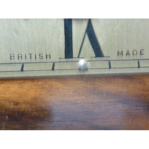 148 - Enfield Clock Co (London) Limited - An Art Deco Chiming mantel clock, with marquetry case, dial mark... 