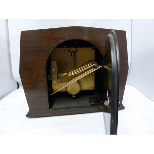 148 - Enfield Clock Co (London) Limited - An Art Deco Chiming mantel clock, with marquetry case, dial mark... 