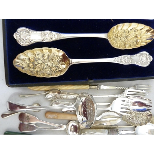 20 - A quantity of EPNS cutlery, mostly fancy wares - jam spoons; a cased set of berry spoons; and other ... 