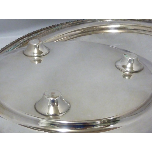 21 - A graduated set of four silver plated salvers, circular with gadrooned edge, the centre engraved wit... 