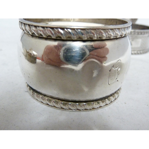 23 - Seven silver napkin rings, including two pairs, various dates and makers, 190 grms approx (7)