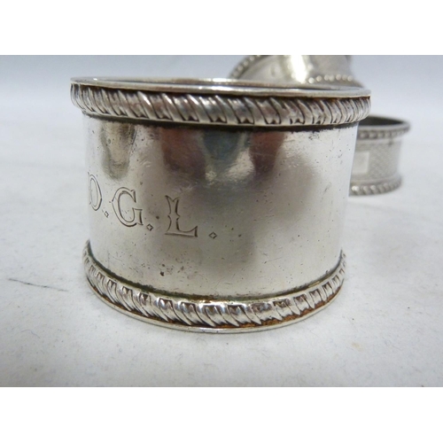 23 - Seven silver napkin rings, including two pairs, various dates and makers, 190 grms approx (7)