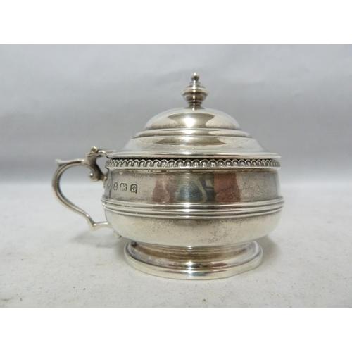 24 - A three piece silver cruet, decorated with beaded and reeded bands beneath vase finials, comprises p... 