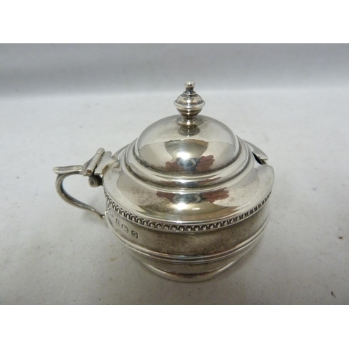 24 - A three piece silver cruet, decorated with beaded and reeded bands beneath vase finials, comprises p... 