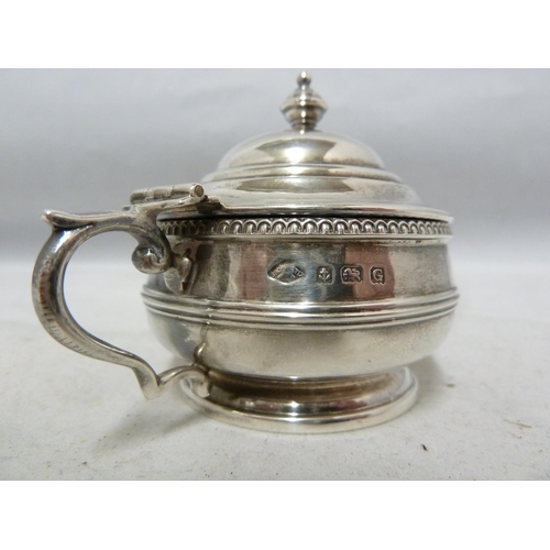 24 - A three piece silver cruet, decorated with beaded and reeded bands beneath vase finials, comprises p... 