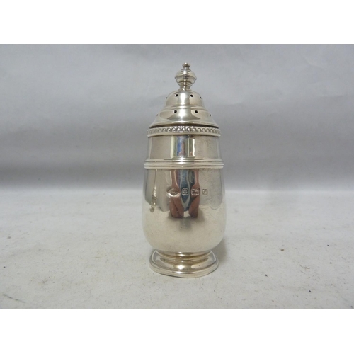 24 - A three piece silver cruet, decorated with beaded and reeded bands beneath vase finials, comprises p... 