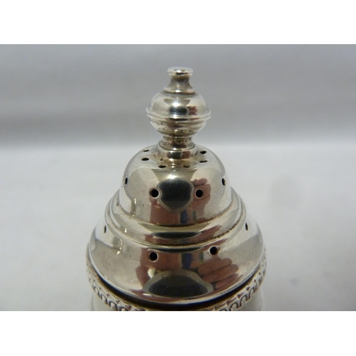 24 - A three piece silver cruet, decorated with beaded and reeded bands beneath vase finials, comprises p... 