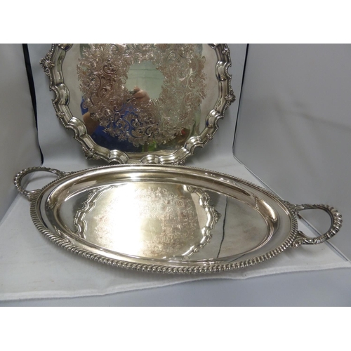 30 - A large silver plated two handled tray, of oval shape, 58cm max diam approx; and one large circular ... 