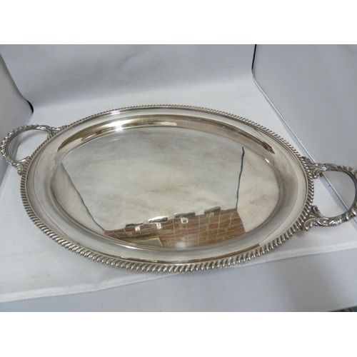 30 - A large silver plated two handled tray, of oval shape, 58cm max diam approx; and one large circular ... 