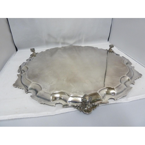 30 - A large silver plated two handled tray, of oval shape, 58cm max diam approx; and one large circular ... 