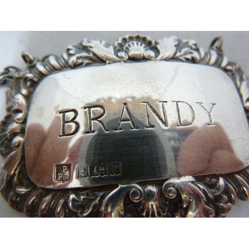 6 - Four silver decanter labels, rectangular with shell and foliate gadrooned frames, marked BRANDY, SHE... 