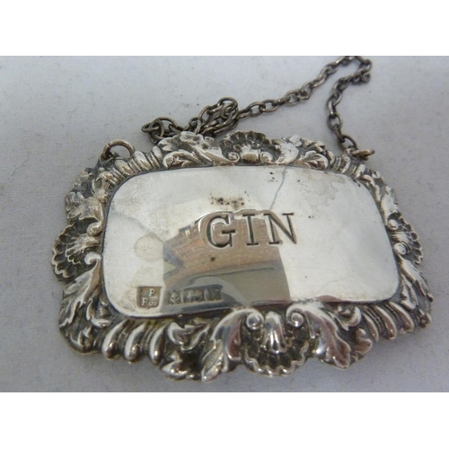 6 - Four silver decanter labels, rectangular with shell and foliate gadrooned frames, marked BRANDY, SHE... 