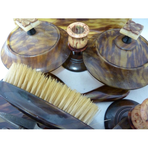 105 - An early plastic Art Deco Dressing table set, includes tray, powder bowl, hair pot and cover, candle... 