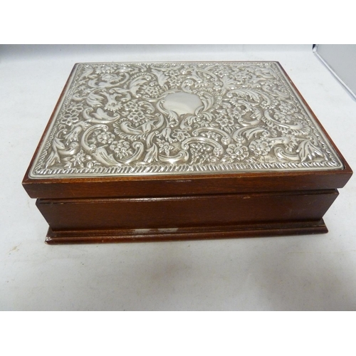 18 - A Victorian style silver mounted dressing table set in fitted cases, the backs repousse decorated wi... 