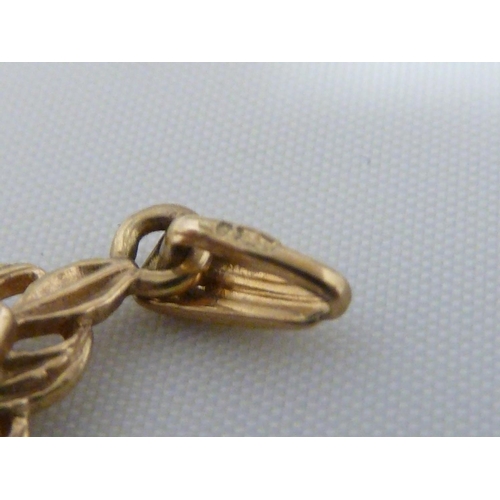 19 - A 9ct yellow gold barley twist bangle, 16.2 grams, internal diam 6.3cm; a 9ct yellow gold charm of a... 