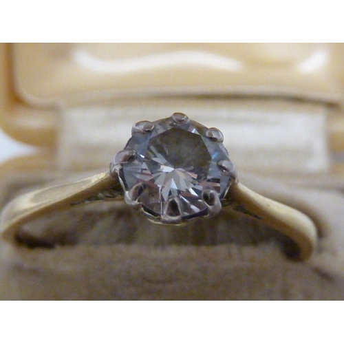 37 - A solitaire diamond ring, the single round diamond of approx 0.5 carat set in an unmarked yellow met... 