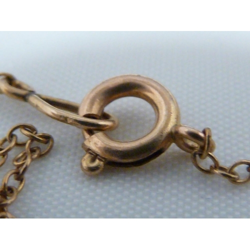 83 - A 9ct yellow gold mounted hardstone fob; a yellow metal two strand leaf link choker, set with a 'blo... 