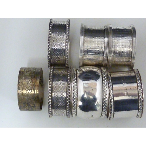 23 - Seven silver napkin rings, including two pairs, various dates and makers, 190 grms approx (7)