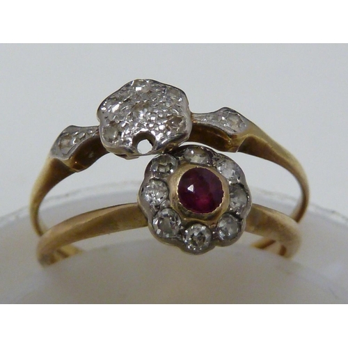 38 - A ruby and diamond ring, the central ruby encircled by eight round brilliant cut stones set in an 18... 