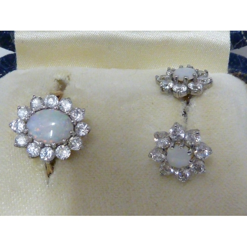 40 - A light opal ring and earring set, the opals encircled by CZ stones, the ring of 9ct yellow gold, ri... 