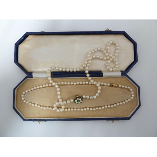 45 - Two strings of cultured pearls with a 14ct yellow gold clasp, stamped 585,  with presentation case, ... 