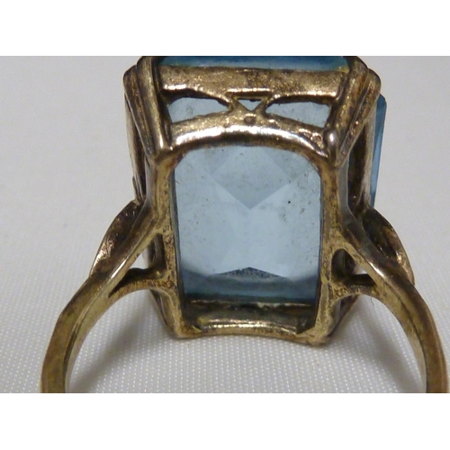 53 - An aquamarine set ring, set in pierced yellow metal, stamped with Arabic marks; a marquise ring and ... 