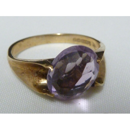 56 - An amethyst ring, the oval stone set at an angle in a 9ct gold shank, ring size M 1/2, 2.5grms; a pe... 