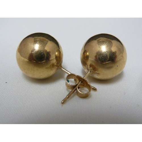 62 - A pair of 9ct yellow gold knot form earrings; and six pairs of yellow metal earrings, 10grms total w... 