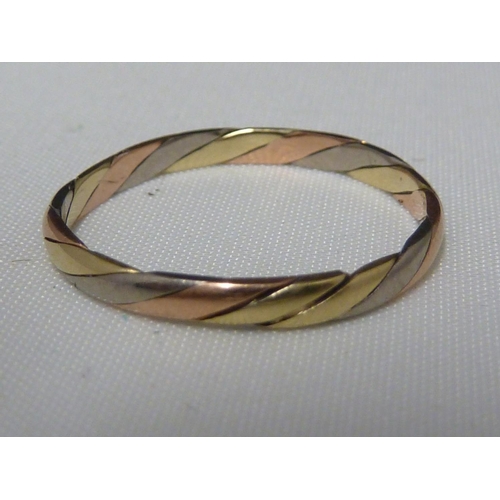 85 - A 9ct three colour gold twist bangle; two 9ct yellow gold bangles, 24.4grms; a yellow metal bangle u... 