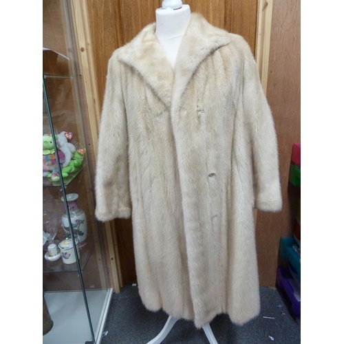 114 - A cream 3/4 length mink coat, with leather bow details to cuffs, size 10 approx