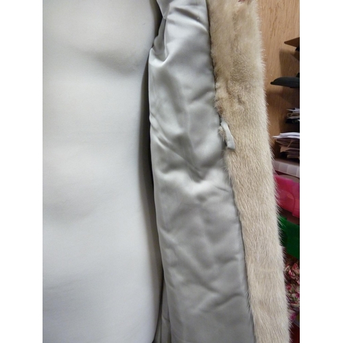 114 - A cream 3/4 length mink coat, with leather bow details to cuffs, size 10 approx