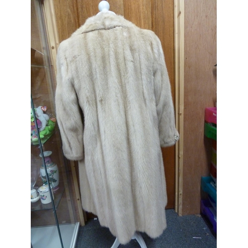 114 - A cream 3/4 length mink coat, with leather bow details to cuffs, size 10 approx