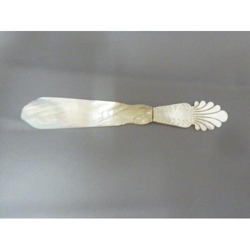 126 - A Regency mother of pearl letter knife, the handle formed as a neo-classical vase with acanthus leaf... 