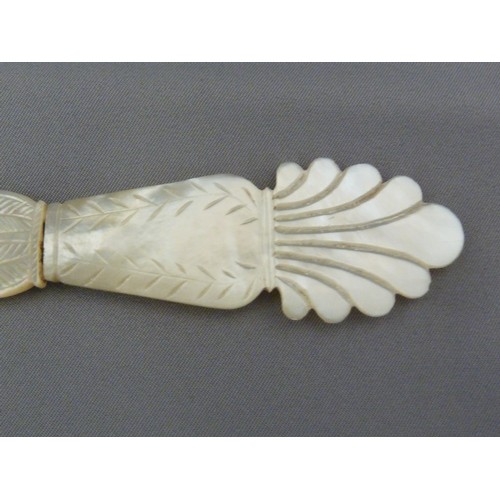 126 - A Regency mother of pearl letter knife, the handle formed as a neo-classical vase with acanthus leaf... 