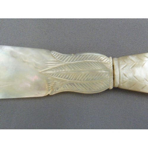 126 - A Regency mother of pearl letter knife, the handle formed as a neo-classical vase with acanthus leaf... 