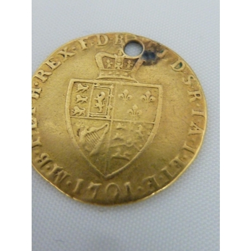 47 - A Victorian half sovereign gold coin, 1892, 4grms approx; and a George I 'Guinea', 4grms (2)