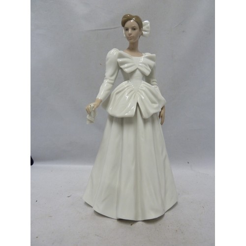 242 - Nao - a porcelain figure of a bride, a handkerchief in one hand, 29cm high; together with the origin... 