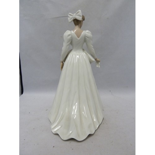 242 - Nao - a porcelain figure of a bride, a handkerchief in one hand, 29cm high; together with the origin... 