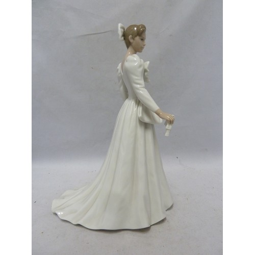 242 - Nao - a porcelain figure of a bride, a handkerchief in one hand, 29cm high; together with the origin... 