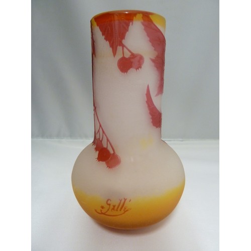 24 - Galle - a cameo glass vase, of onion form, the  cranberry coloured overlay cut through to frosted or... 