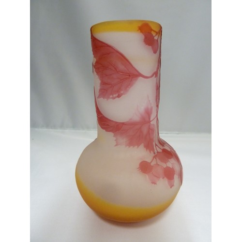 24 - Galle - a cameo glass vase, of onion form, the  cranberry coloured overlay cut through to frosted or... 